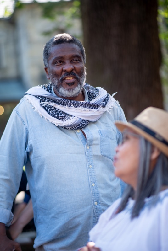 A participant wearing a pale blue vest