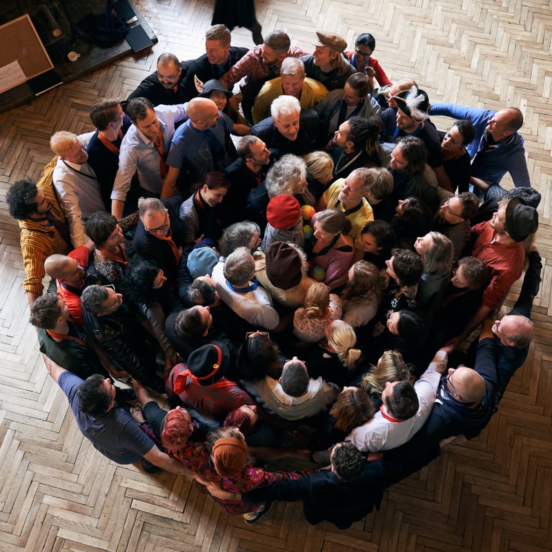 Participants gathered in a close circle